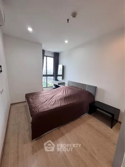 Modern bedroom with city view and minimalist design