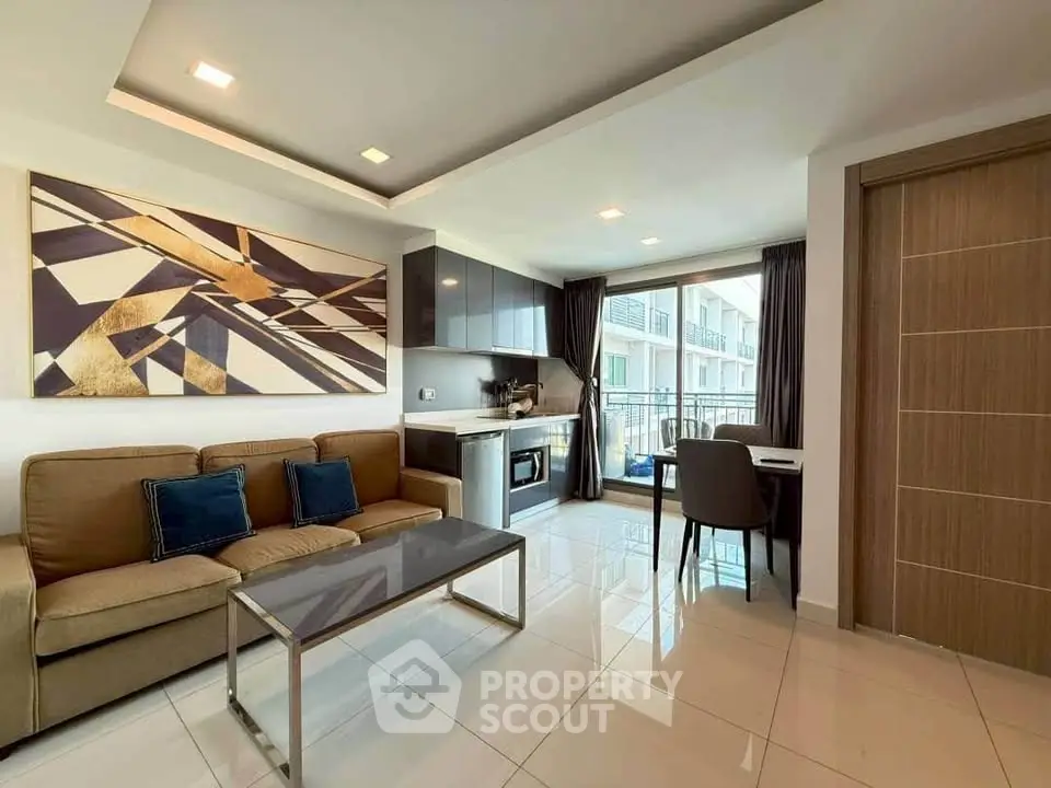Modern living room with open kitchen and balcony in a stylish apartment