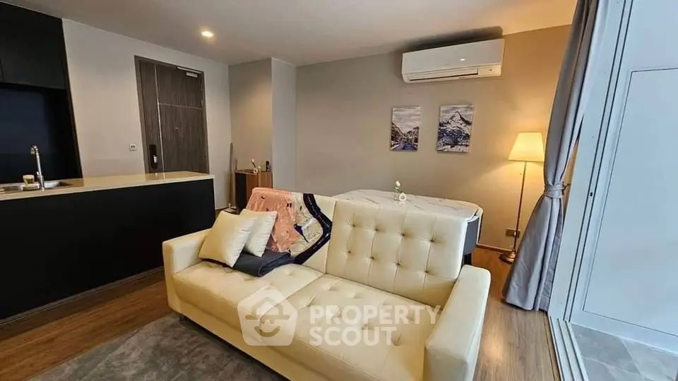 Modern living room with stylish sofa and air conditioning in a cozy apartment