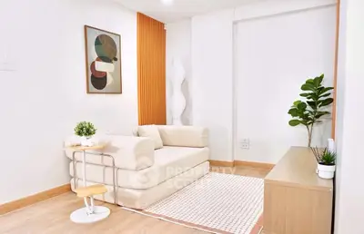 Modern living room with stylish decor and cozy seating area.