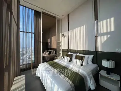 Luxurious bedroom with floor-to-ceiling windows and elegant decor