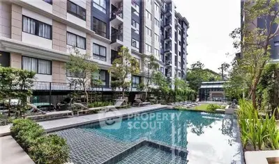 Luxurious condominium with modern pool and lush greenery