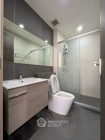 Modern bathroom with sleek design and glass shower enclosure