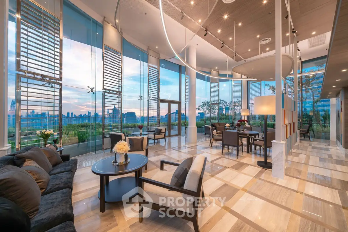 Luxurious modern living room with panoramic city views and elegant decor.