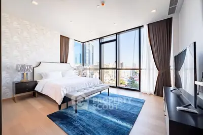 Luxurious bedroom with panoramic city views and modern decor