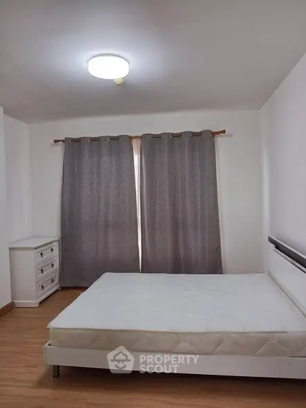 Spacious bedroom with natural light and minimalist decor