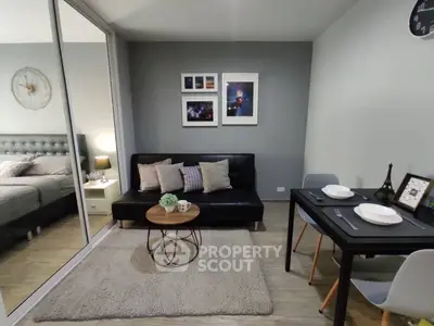 Modern living room with stylish decor and cozy seating area in a contemporary apartment.