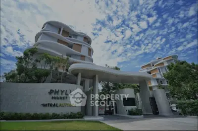 Modern architectural building with unique design and lush greenery in a vibrant neighborhood.