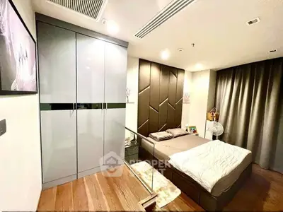 Modern bedroom with stylish decor and sleek wardrobe design