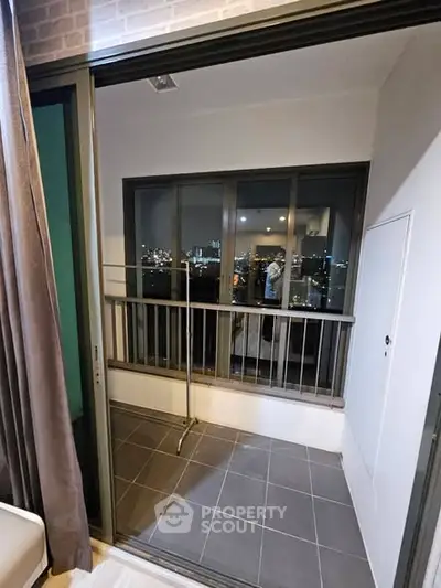 Chic urban balcony with stunning city view, perfect for relaxation and enjoying the skyline.