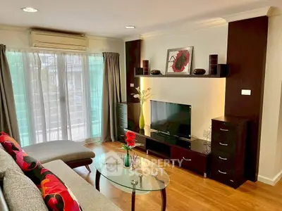 Stylish living room with modern decor, large window, and cozy seating area.