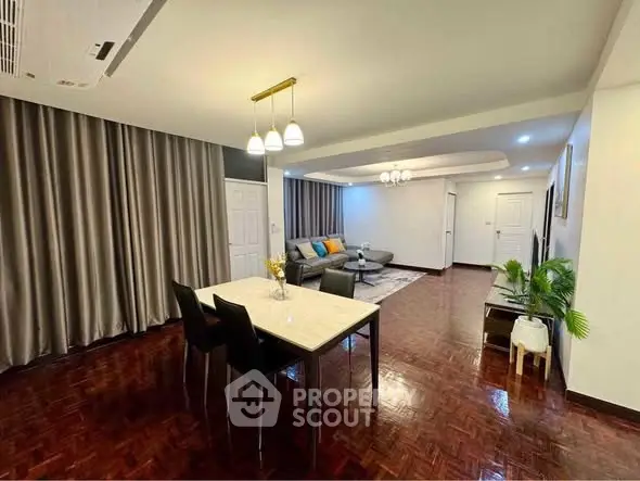 Spacious living room with elegant dining area and modern decor