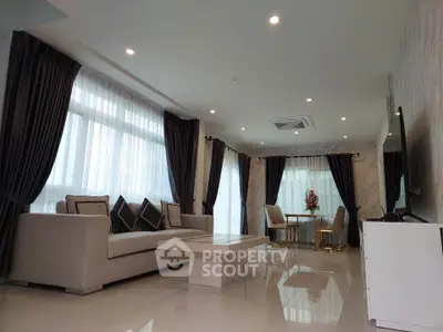 Luxurious modern living room with elegant decor and ample natural light