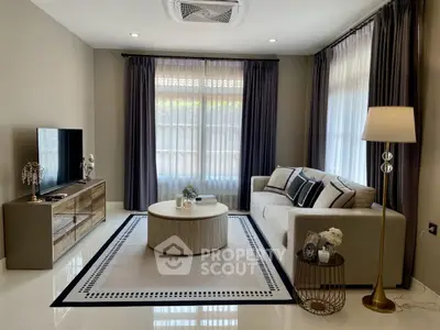 Elegant living room with modern decor, cozy sofa, and stylish coffee table.