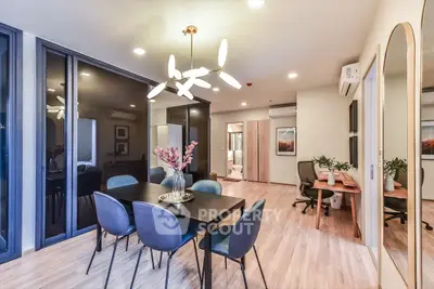 Modern dining area with elegant lighting and stylish decor in a contemporary apartment.