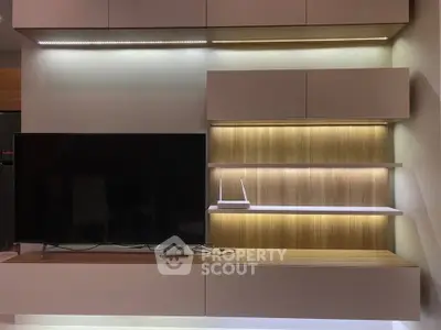 Modern living room with sleek TV unit and ambient lighting