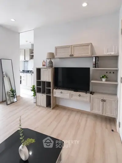 Modern living room with stylish wooden furniture and sleek TV setup
