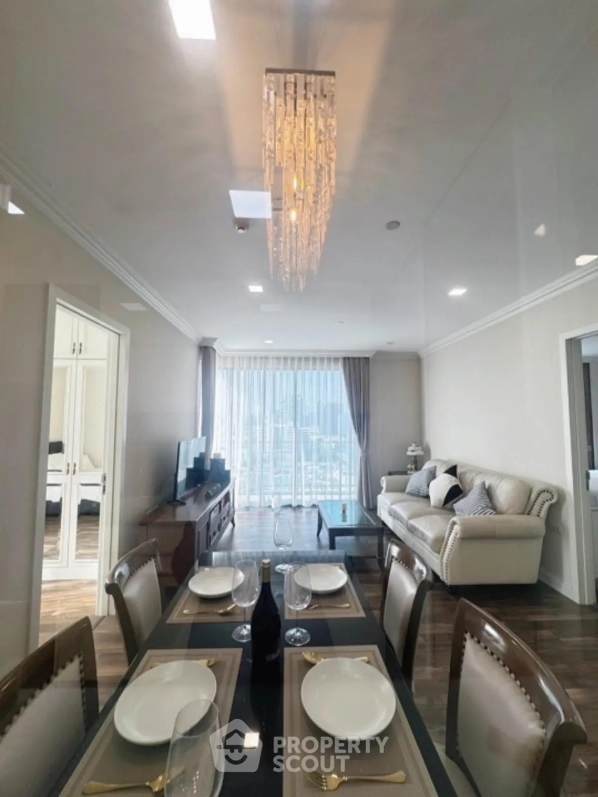 Luxurious living room with elegant dining setup and modern decor