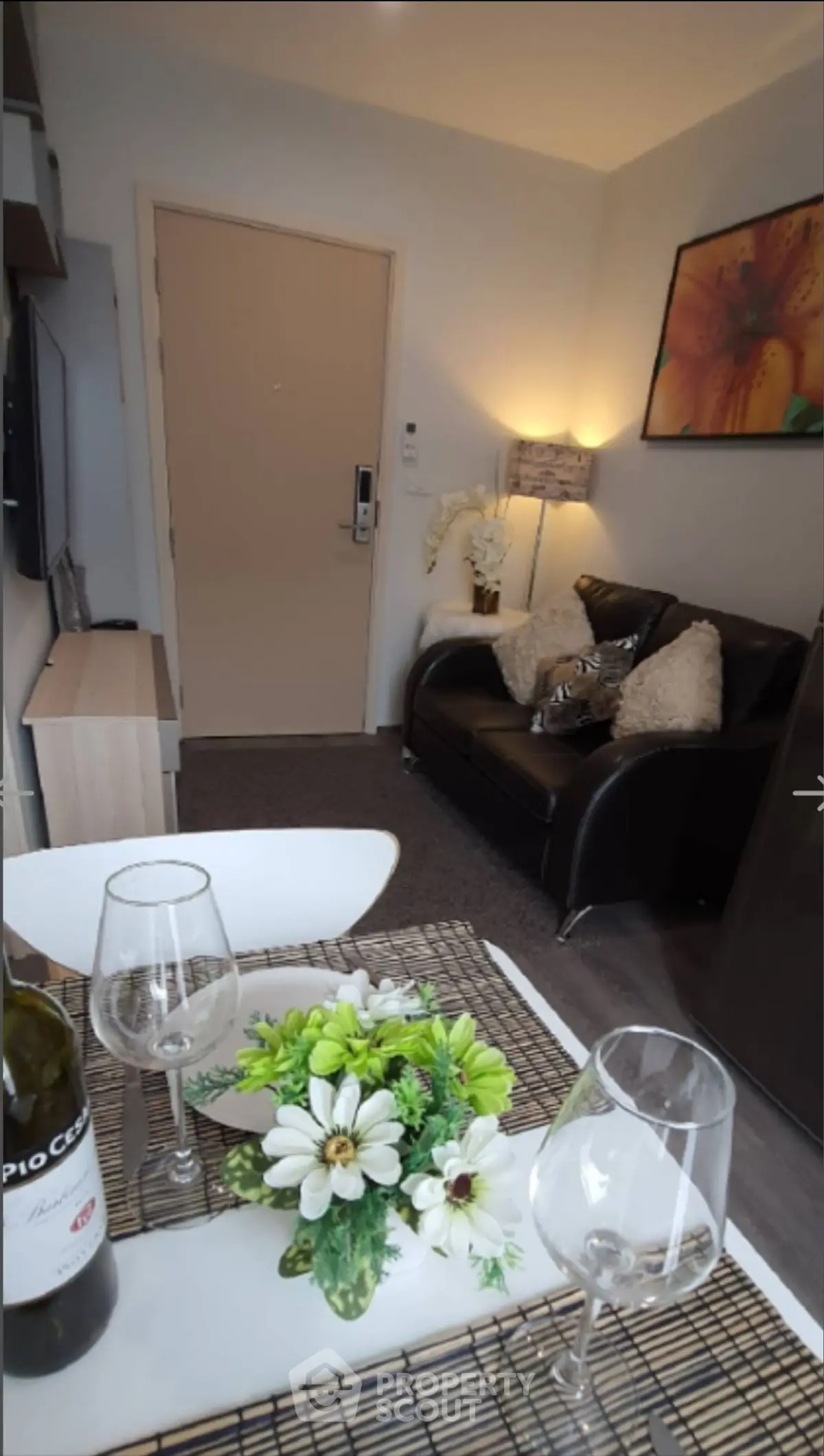 Cozy living room with elegant decor and dining setup, ideal for modern living.