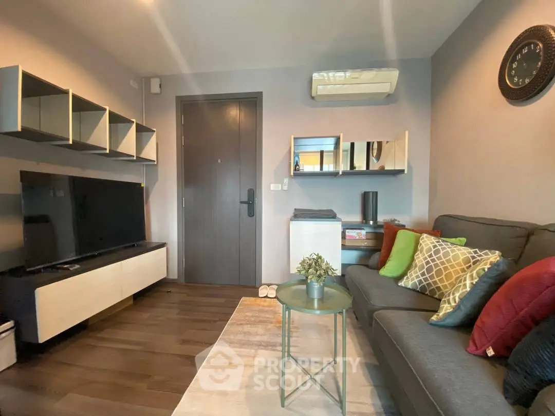 Modern living room with stylish decor and wall-mounted TV unit