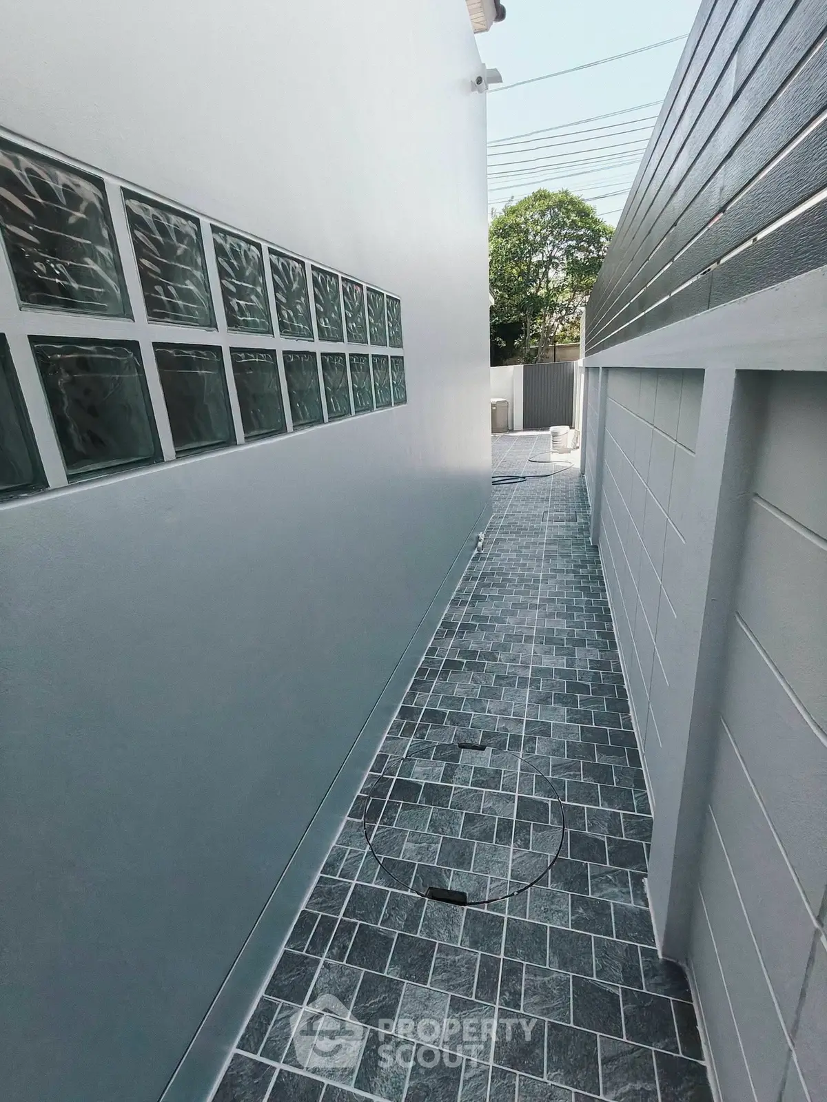 Modern exterior walkway with sleek design and stylish tiles, perfect for contemporary homes.