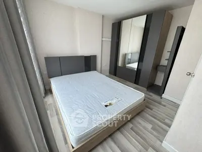 Modern bedroom with sleek wardrobe and minimalist design