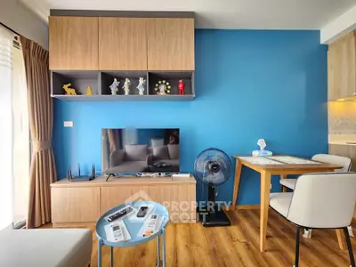 Modern living room with blue accent wall and stylish wooden furniture