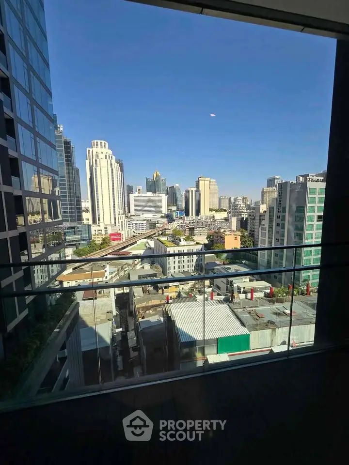 Stunning cityscape view from a modern balcony in a high-rise building, perfect for urban living.