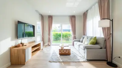 Bright and modern living room with large windows and stylish decor