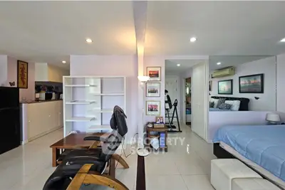 Spacious modern living area with open layout and stylish furnishings in a bright apartment.