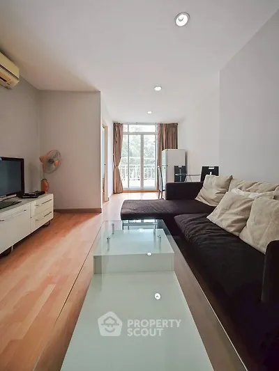 Spacious living room with modern decor and natural light