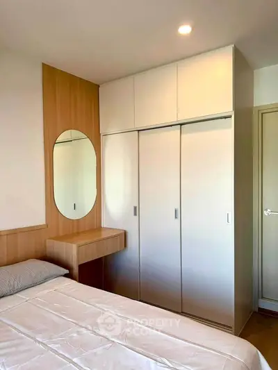 Modern bedroom with built-in wardrobe and stylish wooden accents