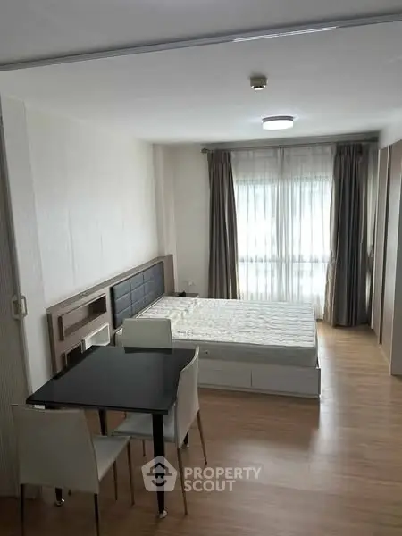Spacious studio apartment with modern furnishings and natural light