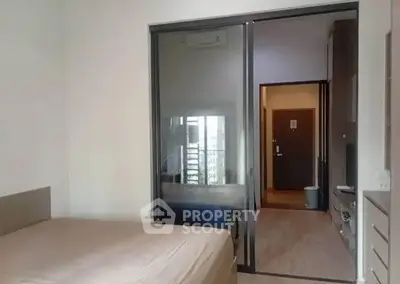 Modern bedroom with sliding glass door and minimalistic design