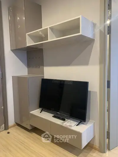 Modern living room with sleek TV unit and stylish storage cabinets