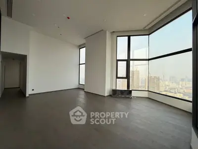 Spacious corner unit with floor-to-ceiling windows offering stunning city views.