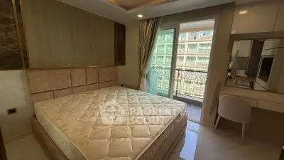 Luxurious bedroom with balcony access in modern apartment