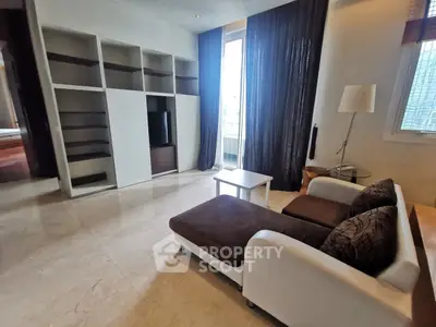 Spacious living room with modern sofa and built-in shelves