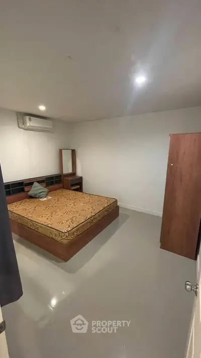 Cozy bedroom with modern furniture and air conditioning