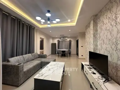 Modern living room with stylish marble accents and contemporary lighting