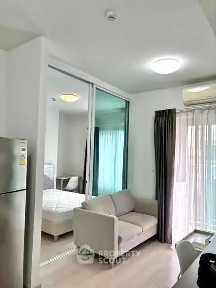 Modern apartment interior with cozy living room and bedroom view