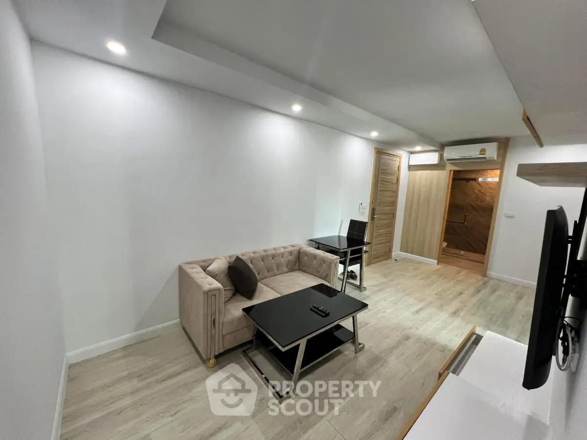 Modern living room with stylish furniture and sleek design, perfect for urban living.