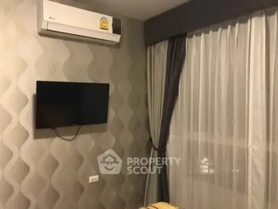 Modern bedroom with air conditioning and wall-mounted TV, featuring elegant curtains and stylish wallpaper.