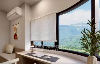 Modern study room with panoramic mountain view and sleek desk setup.