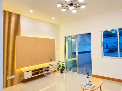 Modern living room with stylish lighting and sleek wooden paneling, featuring a cozy ambiance and contemporary design.