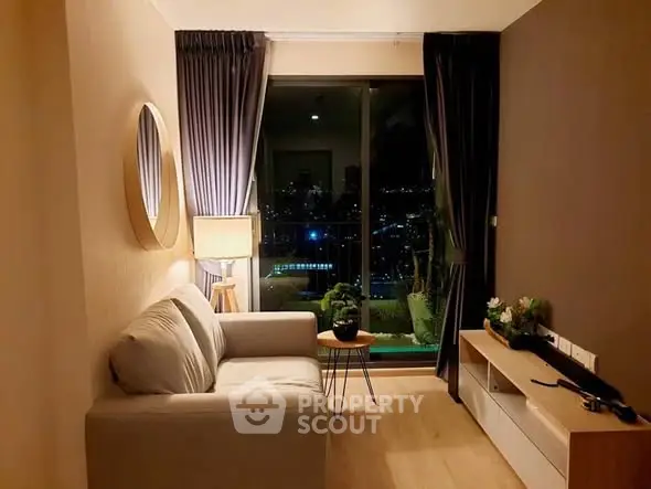 Cozy living room with city view, stylish decor, and ambient lighting.