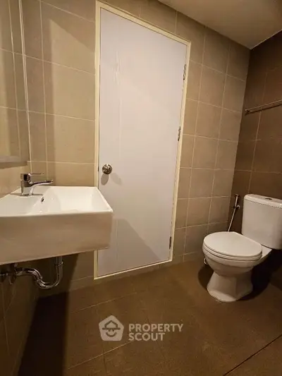 Modern bathroom with sleek fixtures and neutral tile design