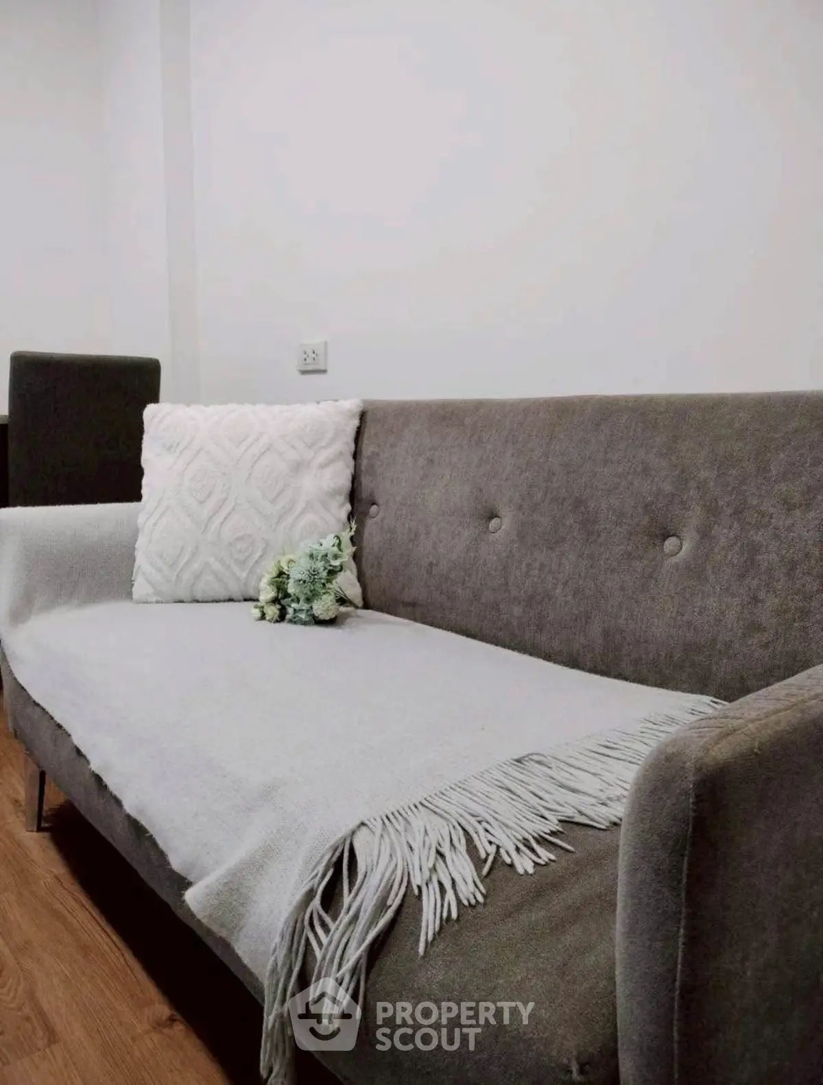 Cozy living room with stylish gray sofa and elegant decor