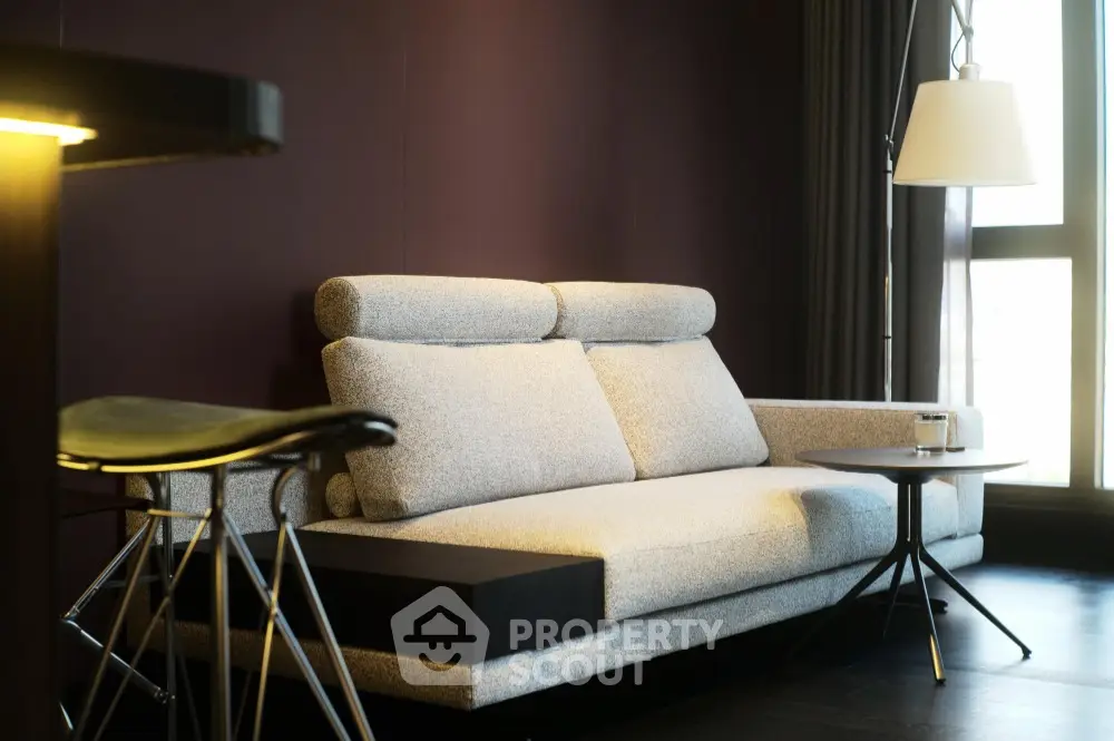 Modern living room with stylish sofa and elegant lighting