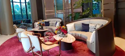 Luxurious modern living room with elegant furniture and vibrant decor in a high-end property.